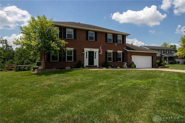 6377 Holloway Dr, Liberty Twp, OH 45044 - colonial home with a garage, concrete driveway, and a front yard