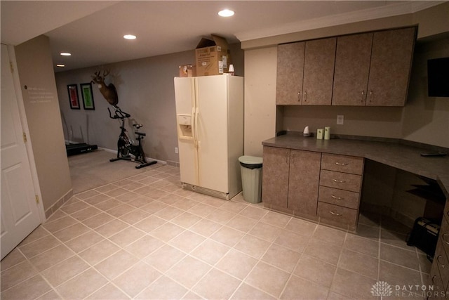 6377 Holloway Dr, Liberty Twp, OH 45044 - kitchen featuring white refrigerator with ice dispenser, recessed lighting, light tile patterned floors, and dark countertops