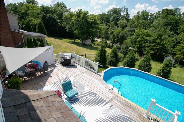 6377 Holloway Dr, Liberty Twp, OH 45044 - swimming pool featuring a deck, outdoor dining area, a yard, and a grill
