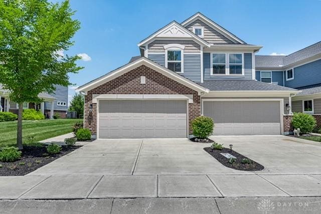 4374 Fairway Ln, Lebanon, OH 45036 - view of front of house featuring concrete driveway, brick siding, and a front lawn