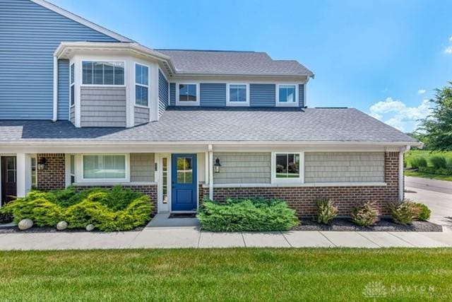 4374 Fairway Ln, Lebanon, OH 45036 - view of front of house with brick siding, concrete driveway, and roof with shingles
