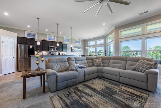 4374 Fairway Ln, Lebanon, OH 45036 - living room featuring recessed lighting, ornamental molding, a ceiling fan, plenty of natural light, and light colored carpet