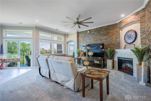 4374 Fairway Ln, Lebanon, OH 45036 - carpeted living area with a ceiling fan, ornamental molding, plenty of natural light, a glass covered fireplace, and arched walkways
