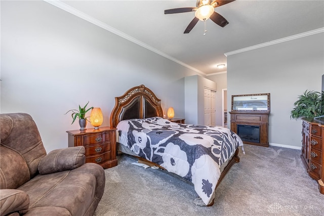 4374 Fairway Ln, Lebanon, OH 45036 - carpeted bedroom with crown molding, a closet, ceiling fan, and a glass covered fireplace