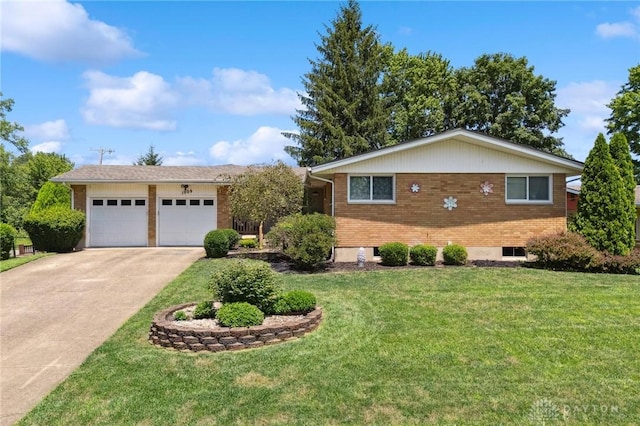 1009 Cottage Court Dr, Fairborn, OH 45324 - view of front of home featuring brick siding, a front lawn, driveway, and an attached garage