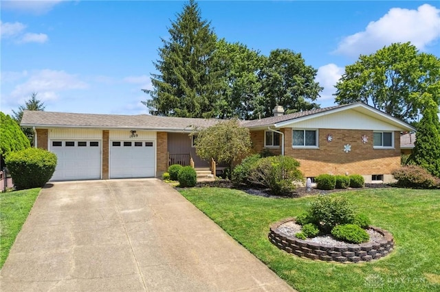 1009 Cottage Court Dr, Fairborn, OH 45324 - ranch-style house with brick siding, concrete driveway, a front yard, a garage, and a chimney