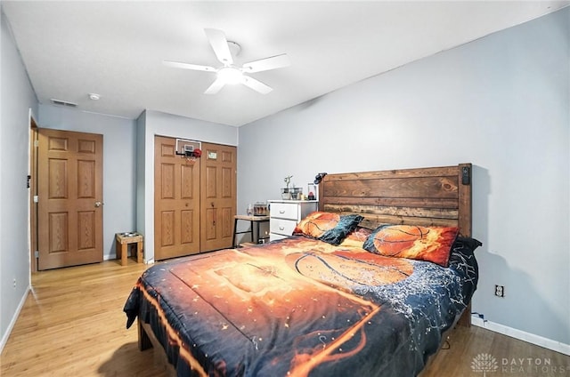 204 Ivy Creek Cv, Jamestown Vlg, OH 45335 - bedroom with wood finished floors, a closet, and a ceiling fan