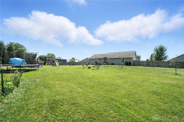 204 Ivy Creek Cv, Jamestown Vlg, OH 45335 - fenced backyard with a trampoline