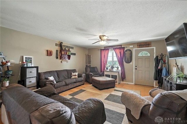 204 Ivy Creek Cv, Jamestown Vlg, OH 45335 - living area featuring ceiling fan, light wood-type flooring, and a textured ceiling