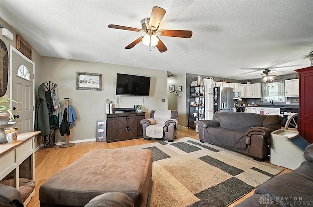 204 Ivy Creek Cv, Jamestown Vlg, OH 45335 - living area with ceiling fan and light wood-type flooring