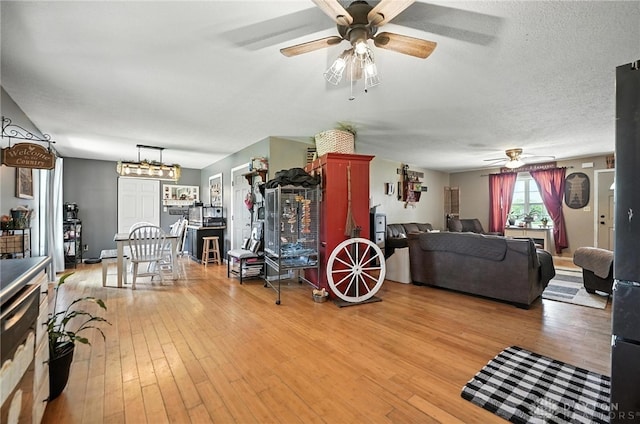 204 Ivy Creek Cv, Jamestown Vlg, OH 45335 - living area with ceiling fan and light wood-style floors