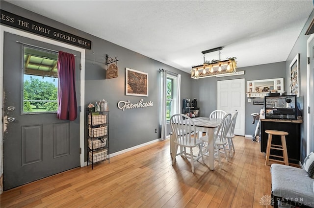 204 Ivy Creek Cv, Jamestown Vlg, OH 45335 - dining area featuring light wood-style floors and baseboards