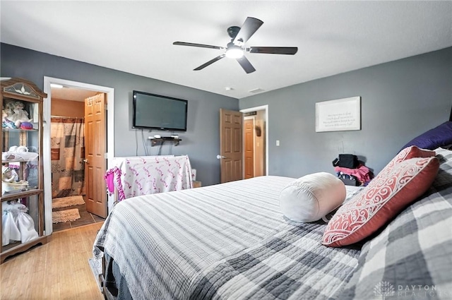 204 Ivy Creek Cv, Jamestown Vlg, OH 45335 - bedroom featuring light wood finished floors, a ceiling fan, and ensuite bathroom