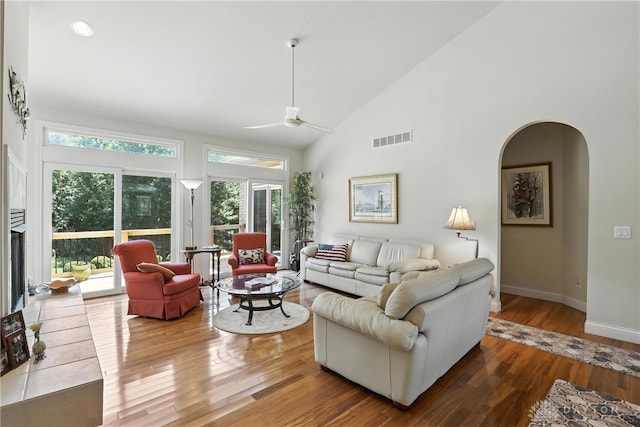 6885 Willow Creek Run, Liberty Twp, OH 45044 - living area featuring high vaulted ceiling, plenty of natural light, wood finished floors, ceiling fan, and arched walkways