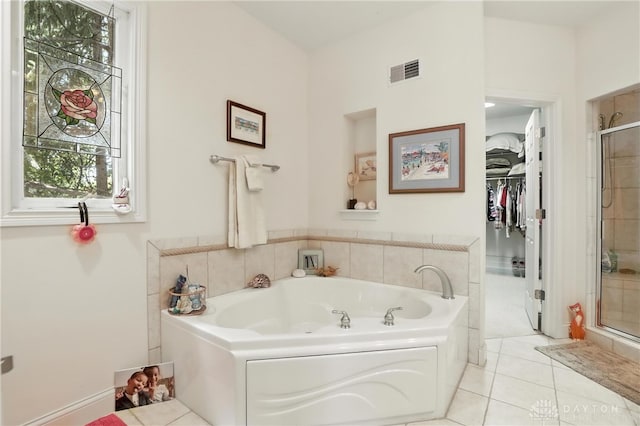 6885 Willow Creek Run, Liberty Twp, OH 45044 - bathroom with a shower stall, a garden tub, tile patterned floors, and a walk in closet