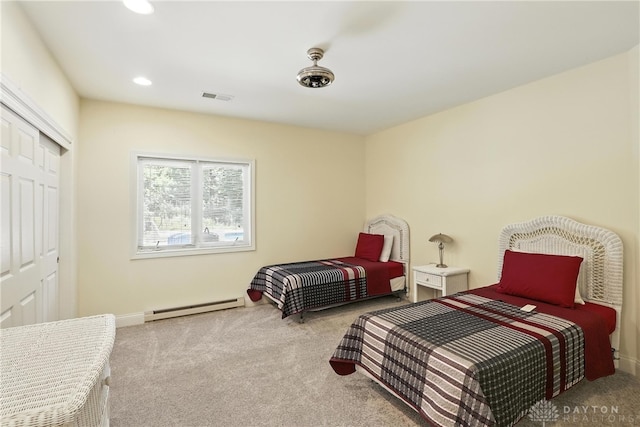 6885 Willow Creek Run, Liberty Twp, OH 45044 - carpeted bedroom with a baseboard heating unit, a closet, and recessed lighting