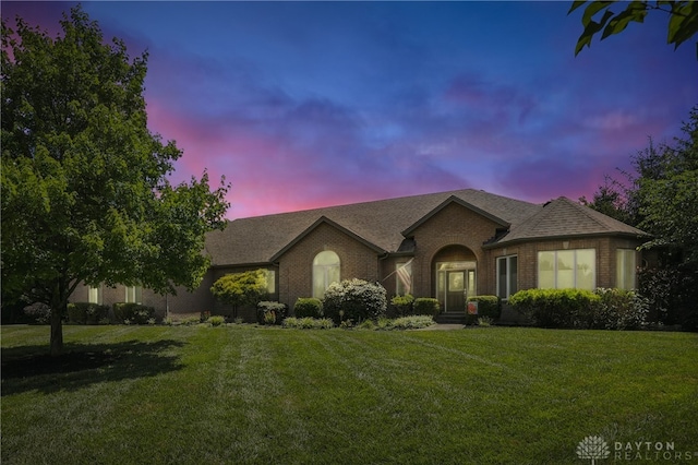 6885 Willow Creek Run, Liberty Twp, OH 45044 - view of front of house with a lawn, brick siding, and a shingled roof