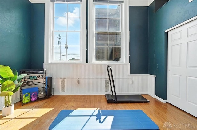 226 Mcdaniel St Unit 160, Dayton, OH 45405 - workout area featuring wood finished floors and a wainscoted wall