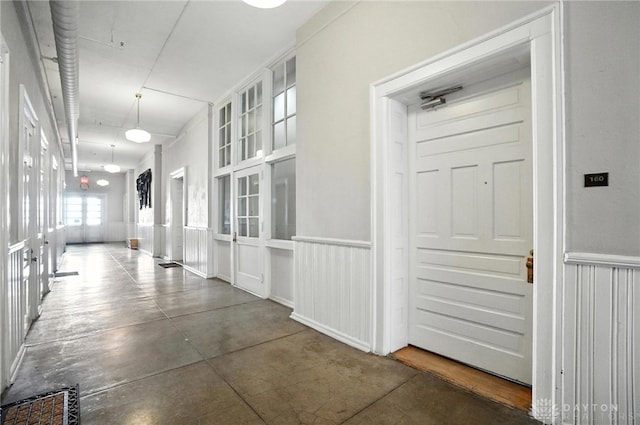 226 Mcdaniel St Unit 160, Dayton, OH 45405 - hallway featuring concrete flooring and a wainscoted wall
