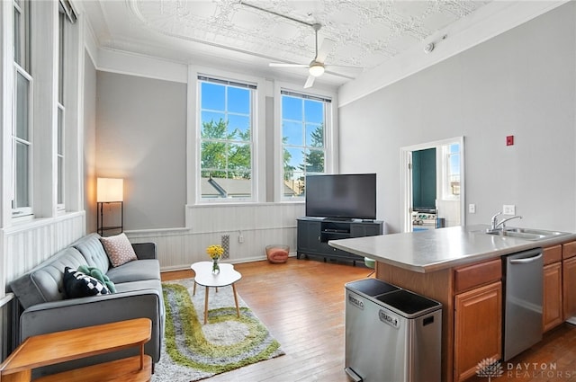 226 Mcdaniel St Unit 160, Dayton, OH 45405 - living room featuring wood-type flooring, an ornate ceiling, a ceiling fan, and wainscoting