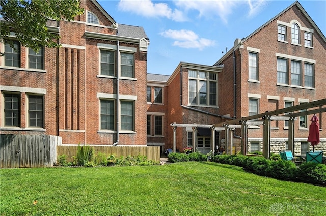 226 Mcdaniel St Unit 160, Dayton, OH 45405 - rear view of house featuring brick siding and a yard