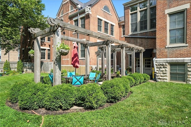 226 Mcdaniel St Unit 160, Dayton, OH 45405 - back of house featuring a pergola, a yard, and brick siding