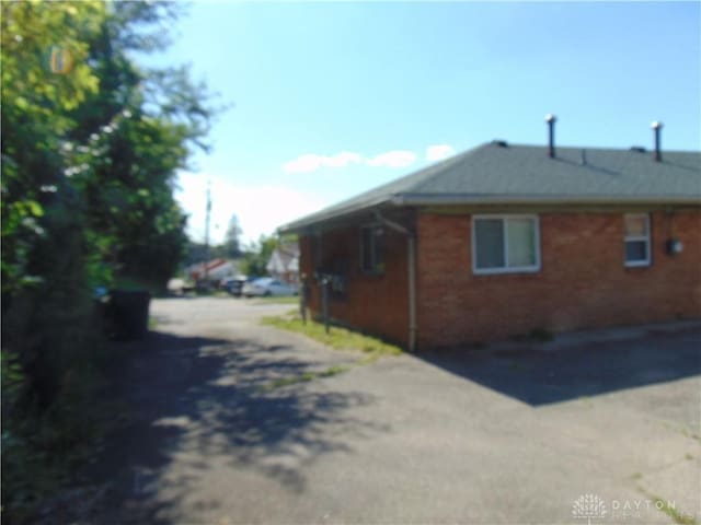 2628 Saint Charles Ave, Dayton, OH 45410 - view of side of property with driveway and brick siding