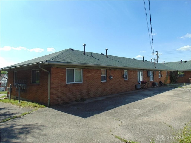 2628 Saint Charles Ave, Dayton, OH 45410 - view of property exterior with brick siding and roof with shingles