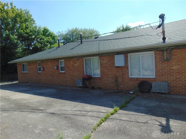 2628 Saint Charles Ave, Dayton, OH 45410 - view of side of home featuring brick siding and a shingled roof