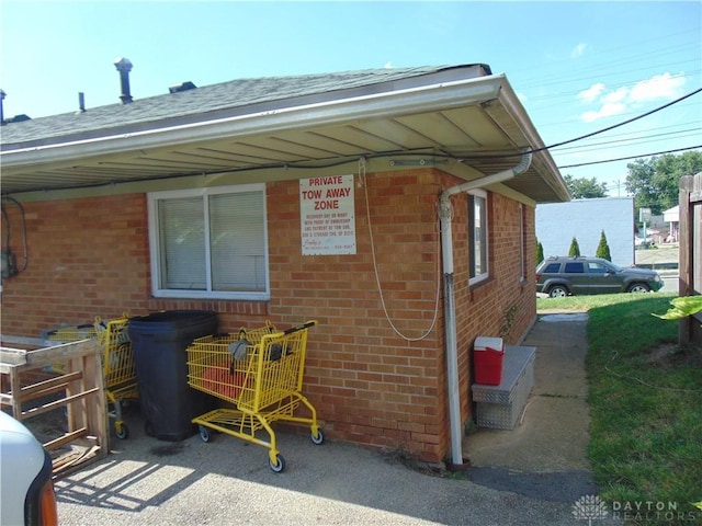 2628 Saint Charles Ave, Dayton, OH 45410 - view of property exterior with brick siding and a shingled roof