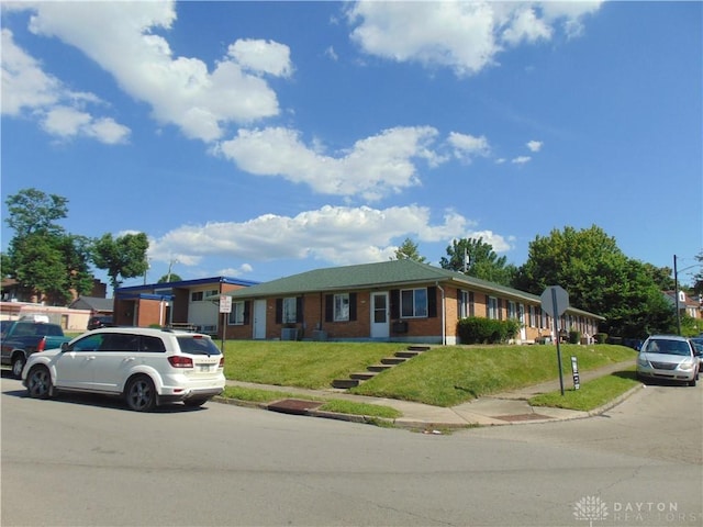2628 Saint Charles Ave, Dayton, OH 45410 - single story home with brick siding and a front lawn