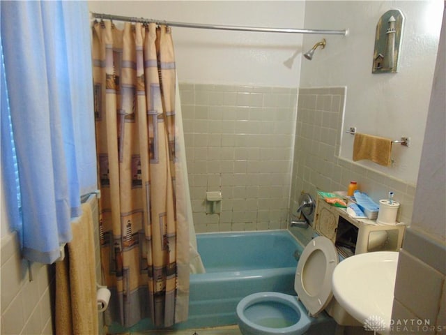 2628 Saint Charles Ave, Dayton, OH 45410 - bathroom featuring tile walls and shower / bath combo with shower curtain