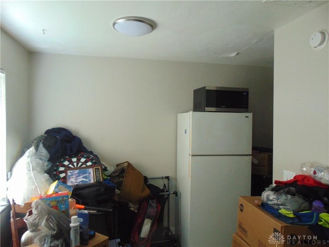 2628 Saint Charles Ave, Dayton, OH 45410 - kitchen with freestanding refrigerator and stainless steel microwave