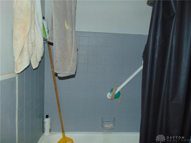2628 Saint Charles Ave, Dayton, OH 45410 - full bathroom with tile walls, shower / bath combo with shower curtain, and wainscoting