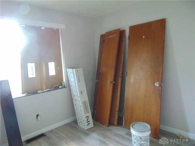 2628 Saint Charles Ave, Dayton, OH 45410 - unfurnished bedroom with wood finished floors and baseboards