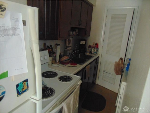 2628 Saint Charles Ave, Dayton, OH 45410 - kitchen featuring white appliances, light countertops, and dark brown cabinets