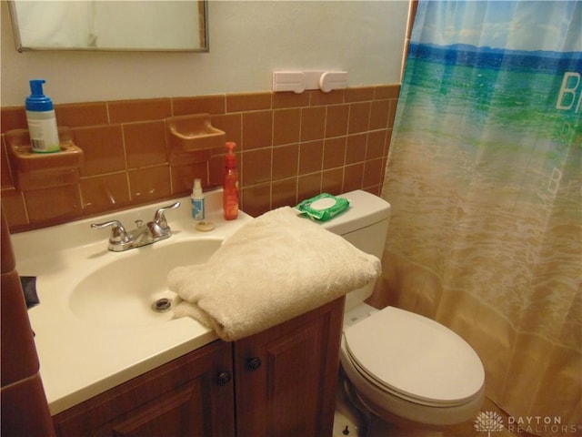 2628 Saint Charles Ave, Dayton, OH 45410 - full bathroom with vanity, a shower with curtain, tile walls, and a wainscoted wall