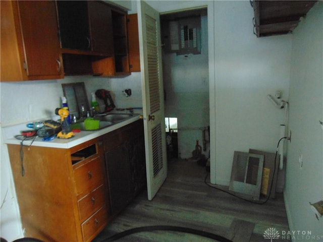 2628 Saint Charles Ave, Dayton, OH 45410 - kitchen with light wood-style floors, light countertops, and brown cabinets