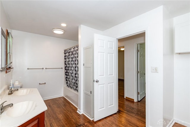 2841 Prospect Dr, Fairborn, OH 45324 - full bathroom with wood finished floors, double vanity, and shower / bath combo