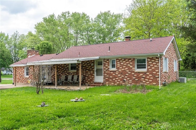 2841 Prospect Dr, Fairborn, OH 45324 - back of house featuring a chimney, a patio area, and brick siding