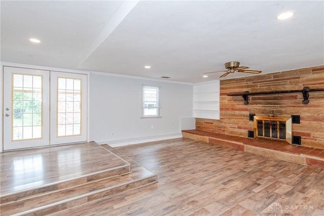 2841 Prospect Dr, Fairborn, OH 45324 - unfurnished living room with a large fireplace, wood finished floors, ceiling fan, recessed lighting, and crown molding
