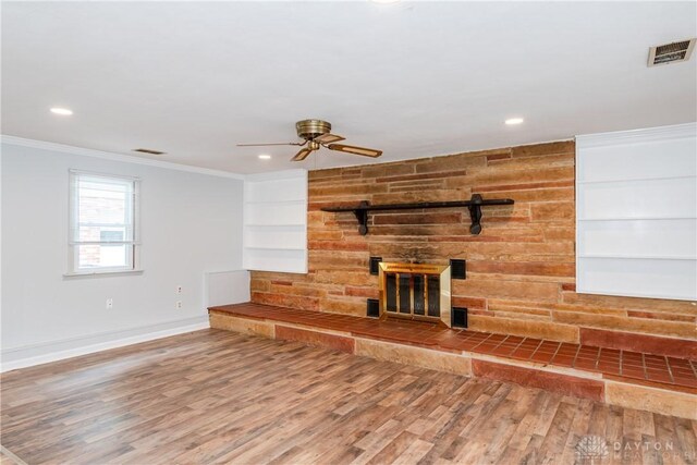 2841 Prospect Dr, Fairborn, OH 45324 - unfurnished living room featuring ceiling fan, wood finished floors, a large fireplace, crown molding, and recessed lighting