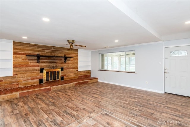 2841 Prospect Dr, Fairborn, OH 45324 - unfurnished living room featuring ceiling fan, a fireplace, recessed lighting, and wood finished floors