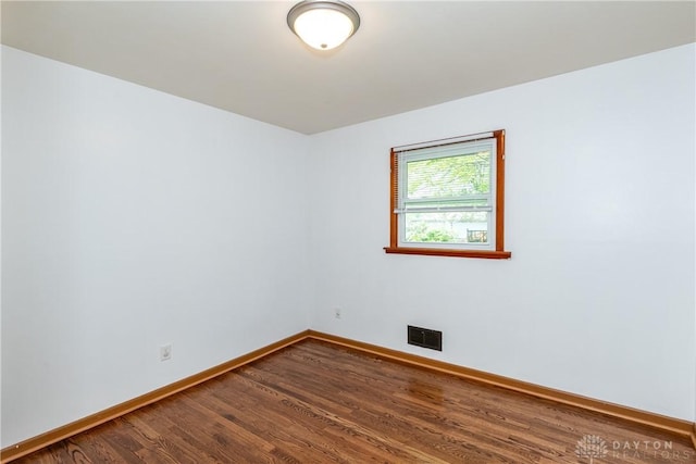 2841 Prospect Dr, Fairborn, OH 45324 - unfurnished room with baseboards and dark wood-style flooring