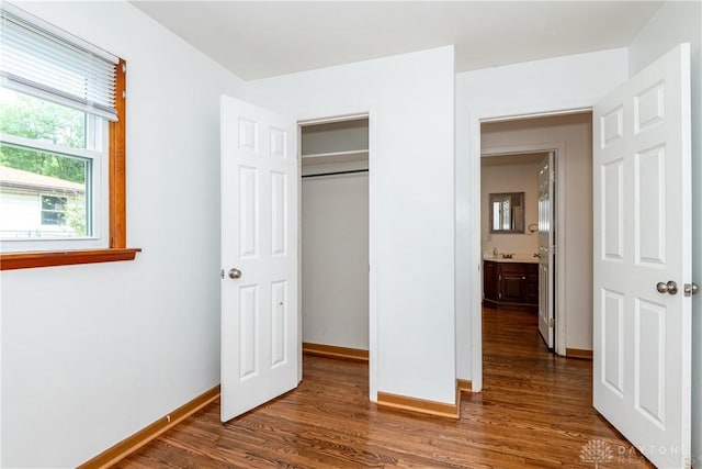 2841 Prospect Dr, Fairborn, OH 45324 - unfurnished bedroom featuring dark wood-type flooring and a closet