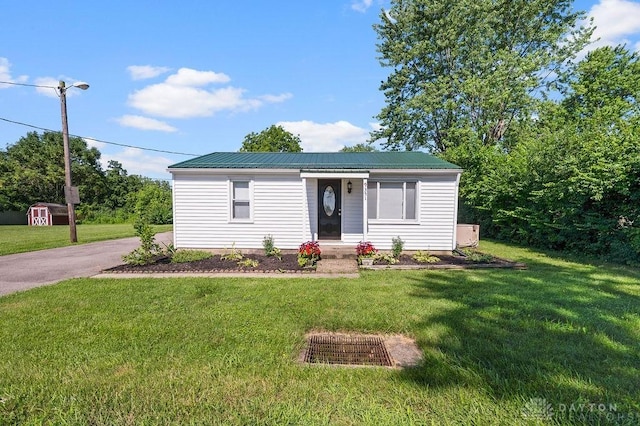 9351 Marcella Dr, Franklin, OH 45005 - view of front facade featuring a front yard, a shed, and a metal roof