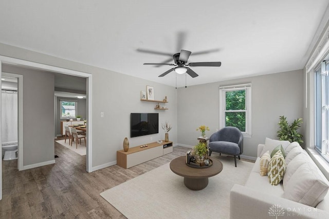 9351 Marcella Dr, Franklin, OH 45005 - living area with plenty of natural light, wood finished floors, and a ceiling fan