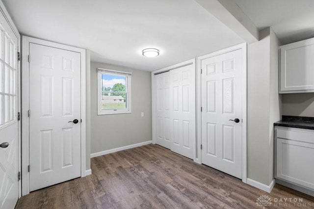 9351 Marcella Dr, Franklin, OH 45005 - unfurnished bedroom with wood finished floors and baseboards