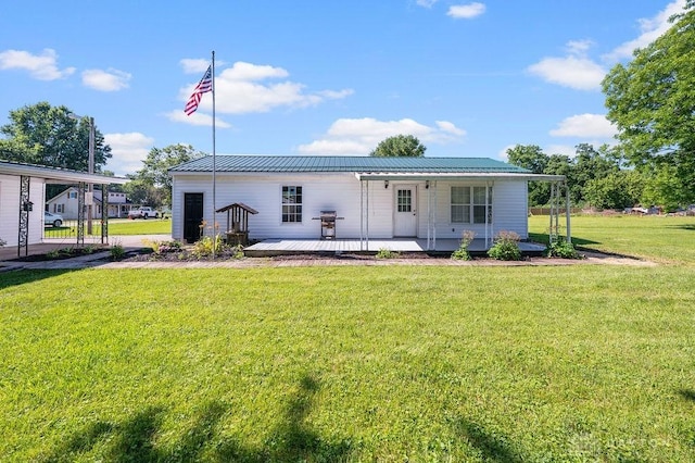 9351 Marcella Dr, Franklin, OH 45005 - view of front of house featuring a front lawn and a metal roof