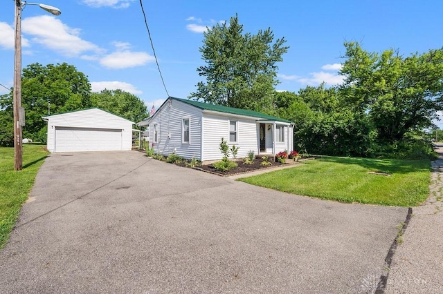 9351 Marcella Dr, Franklin, OH 45005 - view of front of home featuring an outbuilding, a detached garage, and a front lawn